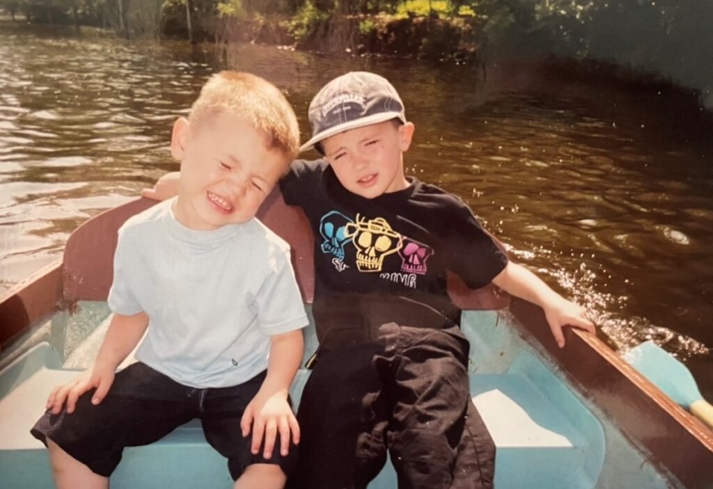 James and brother on a boat