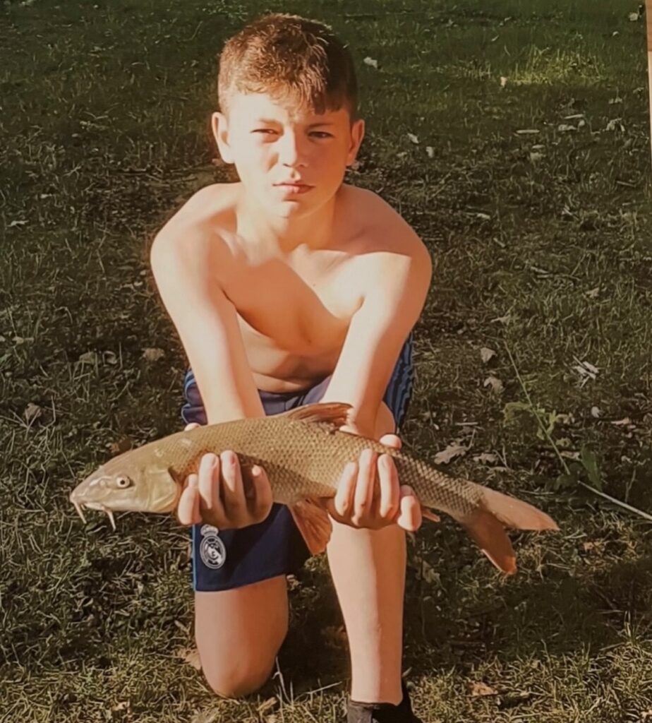 James with a fish he caught